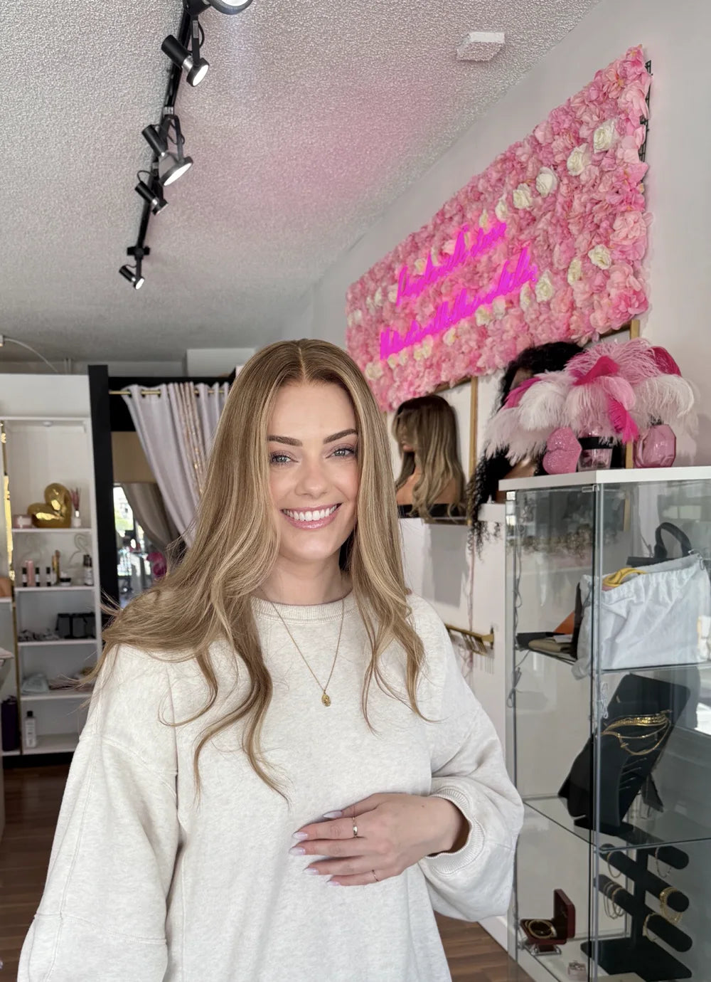 Glamwigs client wearing a natural-looking dimensional blonde human-hair wig in the Calgary studio